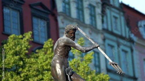 Closeup shot of Neptune statue in the middle of Gdansk city in Poland photo