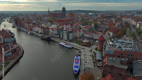 Aerial view of drone flying forward to the old town of Gdansk, Poland above the Motlawa river photo