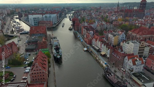 Aerial shot of drone flying above Motlawa river and old town of Gdansk, Poland photo