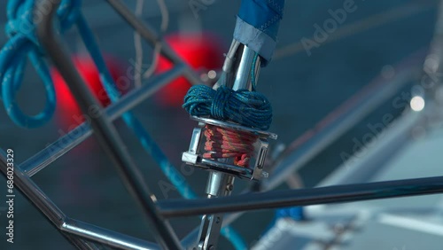 Closeup shot of the part of the mast on the yacht moored in the marina photo