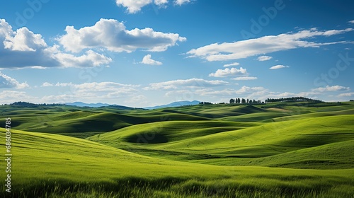 Tuscany landscape with green fields and blue sky. Italy.