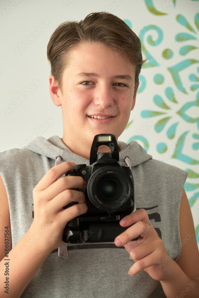 a boy with camera in his hands a boy with camera in his hands
