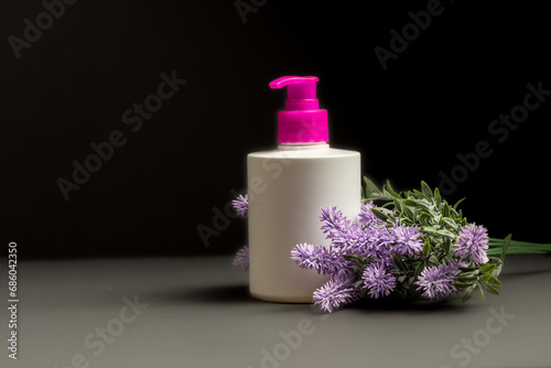 Soap packaging with lavender flowers on black background