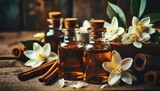 essential oils with jasmine, cinnamon and vanilla on rustic wooden table, retro style. Spa and wellness aromatherapy treatment 