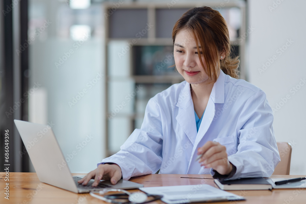 Asian female doctor with patient clipboard at hospital, Medicine and healthcare concept. Asian female doctor with patient clipboard at hospital, Medicine and healthcare concept.