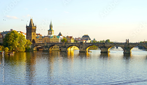 Prague - Charles bridge, Czech Republic. September 2023. Scenic aerial sunset on the architecture of the Old Town Pier and Charles Bridge over the Vltava River in Prague, Czech Republic.