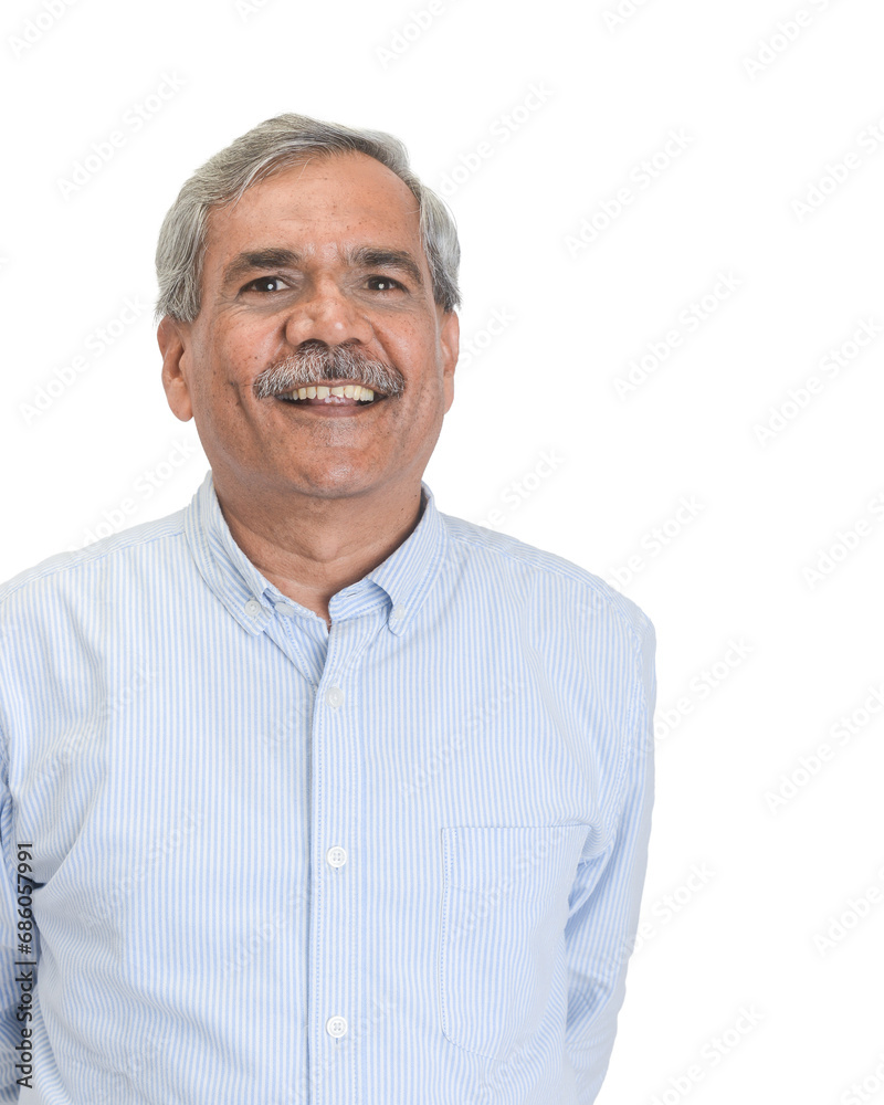 Senior Indian businessman or executive in a light blue shirt Senior Indian businessman or executive in a light blue shirt