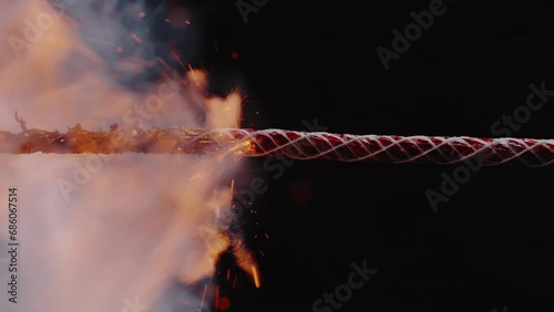 Rapid Sparking Flame Travelling Along Braided Fuse Wire photo