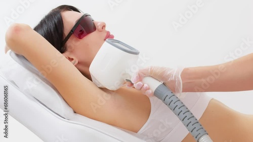 Hair removal-depilation. A young woman undergoes a laser hair removal procedure, close-up. Dermatology, photorejuvenation. Cosmetic clinic. Laser hair removal. photo