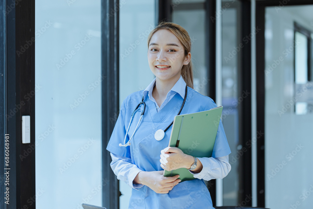 Asian female doctor with patient clipboard at hospital, Medicine and healthcare concept. Asian female doctor with patient clipboard at hospital, Medicine and healthcare concept.