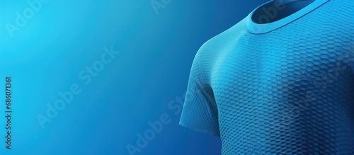 Football jersey made of blue fabric with air mesh texture background Copy space image Place for adding text or design photo