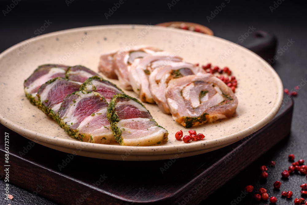 Delicious meatloaf with lard, salt, spices and herbs cut into slices Delicious meatloaf with lard, salt, spices and herbs cut into slices