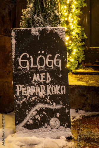Photography Stockholm, Sweden A blackboard covered in snow says Glogg with pepparkaka in the