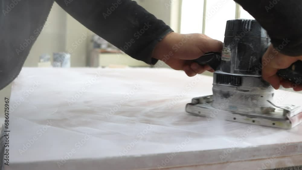 Carpentry work. Joinery industry. Woodwork manufacturing. Craftsman hands polishing wood plank using sander tool in workshop with sawdust free space. High quality 4k footage Carpentry work. Joinery industry. Woodwork manufacturing. Craftsman hands polishing wood plank using sander tool in workshop with sawdust free space. High quality 4k footage