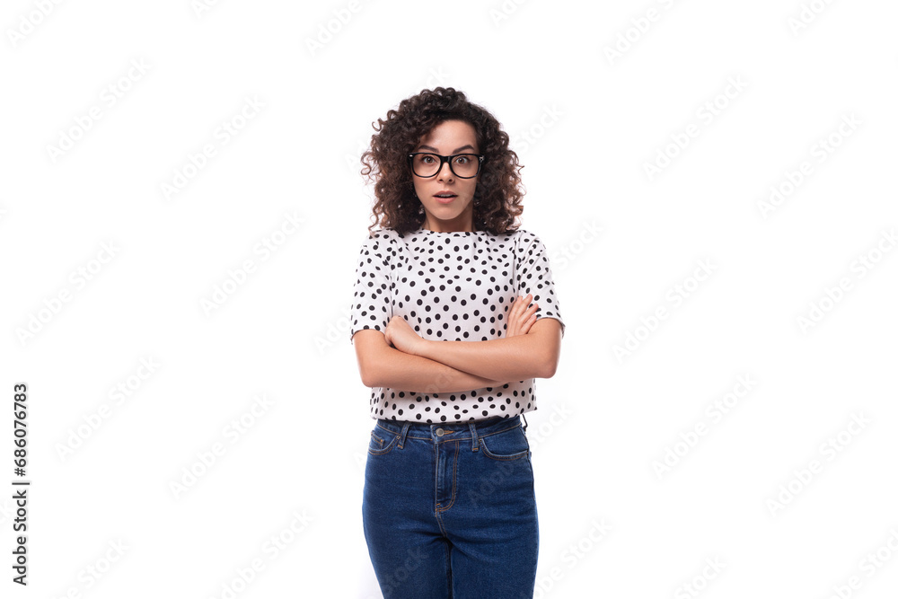 cute curly young brunette with shoulder length hair wearing a summer blouse wears eyeglasses cute curly young brunette with shoulder length hair wearing a summer blouse wears eyeglasses
