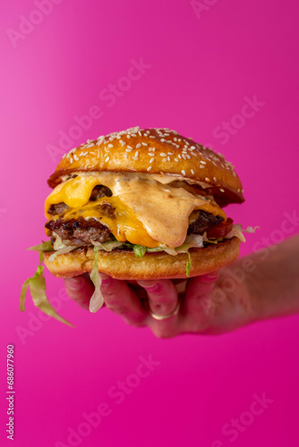 Double Beef Burger Stacked With Melted Cheese Dripping On Hot Pink Background, Editorial Bold Creative Colour 