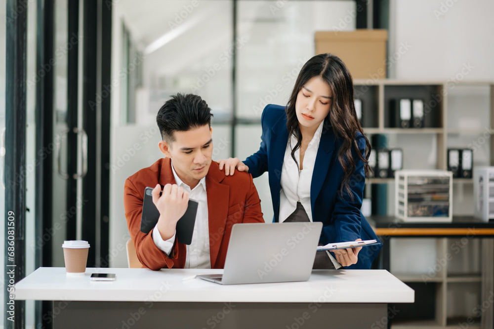 Kind leader executive manager share and discuss business solutions plan ideas with Asian female marketing manager . Kind leader executive manager share and discuss business solutions plan ideas with Asian female marketing manager .