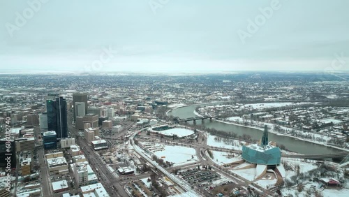 Establishing Wide Angle Shot Full Canadian Museum of Human Rights Urban Winnipeg Manitoba Canada Downtown Skyscraper Buildings City Overcast Landscape Skyline Snowing Winter Drone 4k Shot Static View photo