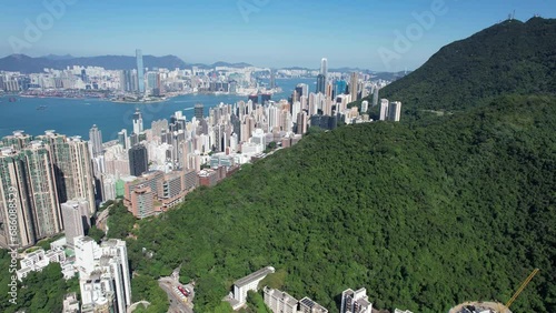 Pok Fu Lam Road, mixed forested and dense build areas on mountain slopes, connecting Aberdeen, Ap Lei Chau, Central and Sheung Wan in Hong Kong. Aerial drone Skyview from Kennedy Town to Cyberport San photo