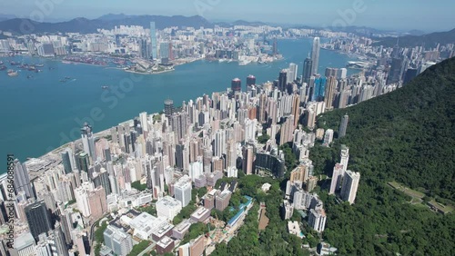 Pok Fu Lam Road, mixed forested and dense build areas on mountain slopes, connecting Aberdeen, Ap Lei Chau, Central and Sheung Wan in Hong Kong. Aerial drone Skyview from Kennedy Town to Cyberport San photo