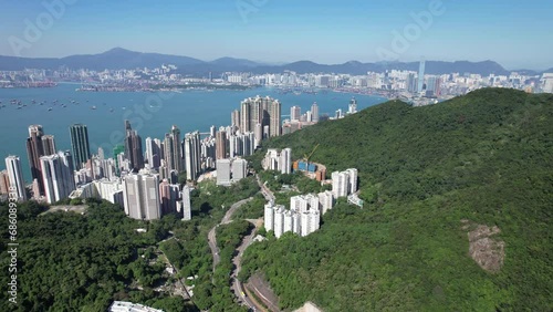 Pok Fu Lam Road, mixed forested and dense build areas on mountain slopes, connecting Aberdeen, Ap Lei Chau, Central and Sheung Wan in Hong Kong. Aerial drone Skyview from Kennedy Town to Cyberport San photo