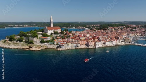Wallpaper Mural Aerial view as a boat is leaving the old town of Rovinj, famous medieval Croatian city at the sea. Istria, Croatia. Torontodigital.ca