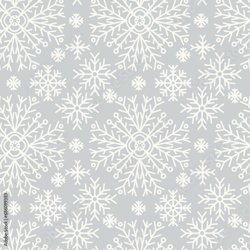 Seamless abstract pattern with snowflakes. Grey, white. Christmas, New Year. Ornament. Designs for textile fabrics, wrapping paper, background, wallpaper, cover.