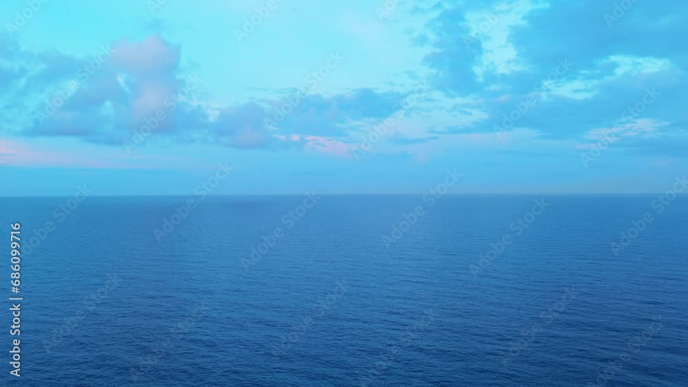 Cloudy blue sky above dark blue Caribbean sea ocean water, empty blank slate Cloudy blue sky above dark blue Caribbean sea ocean water, empty blank slate