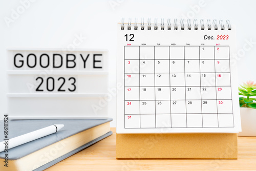 December 2023, Monthly desk calendar and goodbye 2023 text. © gamjai