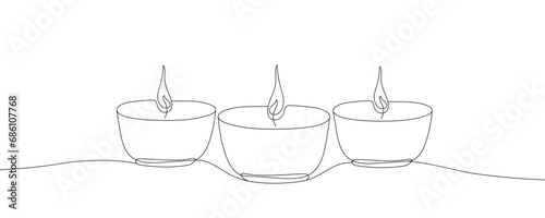 Three candles contour drawing banner. Vector continuous one line drawing oil lamps for diwali festival in silhouette isolated on a white background. Diwali outline illustration