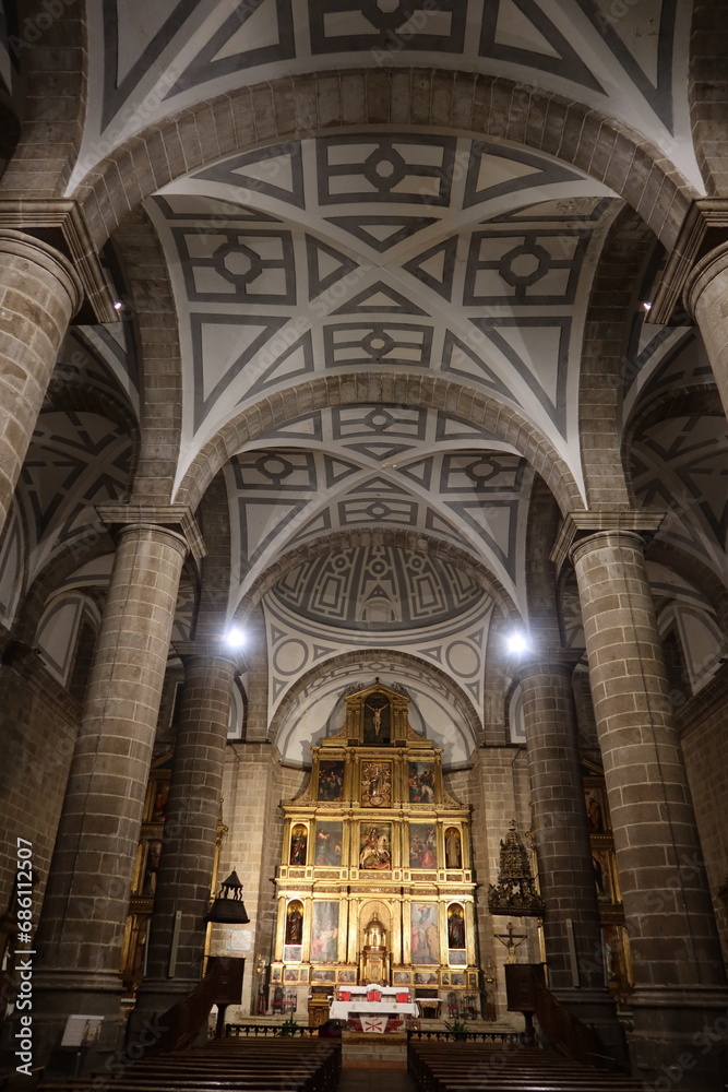 Cebreros, Avila, Spain, November 28, 2023: Altar, columns and ceiling of the Santiago Apostol Church, 16th century, in the town of Cebreros, Avila, Spain
