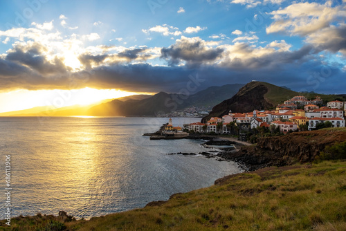 Sunset on Ponta de Sao Lourenco peninsula with traditional resort village. Madeira Island Portugal. photo