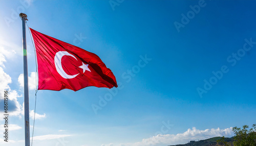 Turkish flag waving in the blue sky