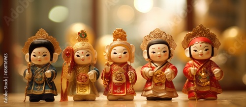 Wealth god dolls, Chinese New Year decor, "fu" character on clothes represents fortune.