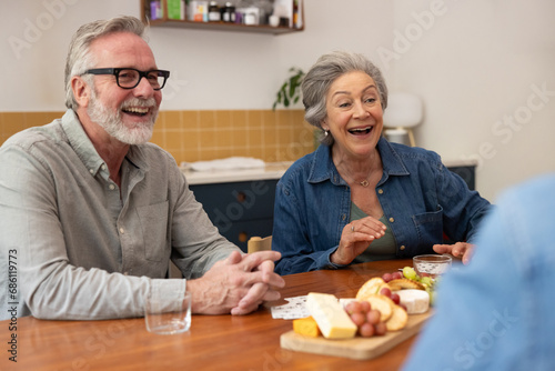 Seniors socialising with friends at home