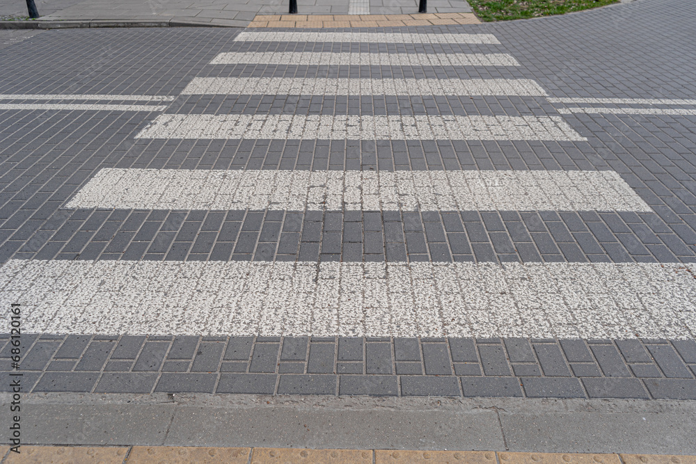 Obraz premium Paved Pedestrian Crossing, Grey White Crosswalk, Safety Zebra on Modern Tiles Pathway