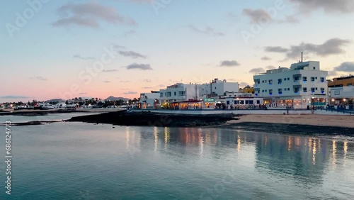Early evening view of Corralejo waterfront and town beach Corralejo Fuerteventura, Canary islands, Spain. photo