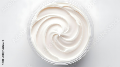 Top View of Whipped Face Cream Texture in White Container © HappyKris