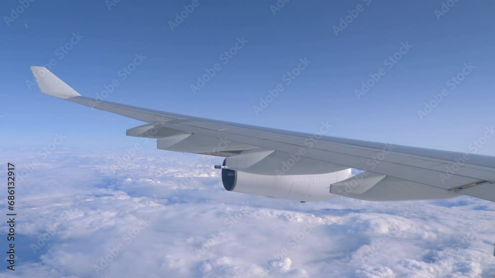 Aerial View of an Airplane Flying High Above the Clouds in 4k Aerial View of an Airplane Flying High Above the Clouds in 4k