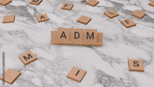 ADM word written on scrabble photo