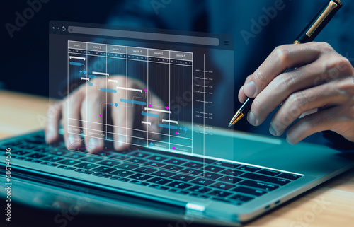 businessman schedule plan management shows a timeline Gantt chart in technology online. concept manage milestones, project planner in software, work update and workflow, appointment staff of business
 photo