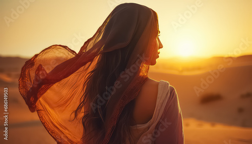 Beautiful woman in the desert at sunset, ramadan concept