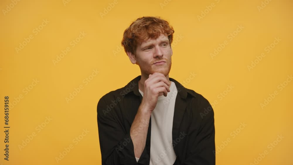 Thoughtful Guy Considering Options on Yellow Background Thoughtful Guy Considering Options on Yellow Background