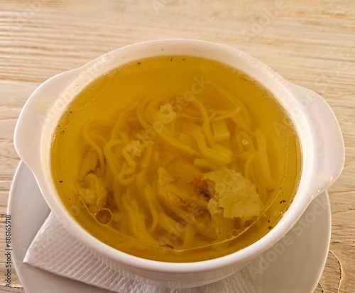 Broth - chicken soup with noodles in a bowl