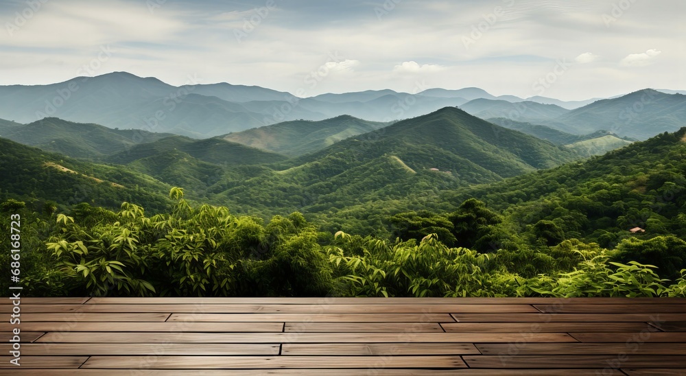 Expansive Wooden Deck Overlooking Layers of Lush Green Mountains Under a Hazy Sky - obrazy, fototapety, plakaty 