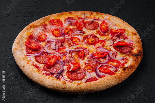 tasty pepperoni pizza with red chili pepper and onion
