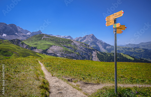 Standard signage of directions of hiking trails in the Swiss Alps