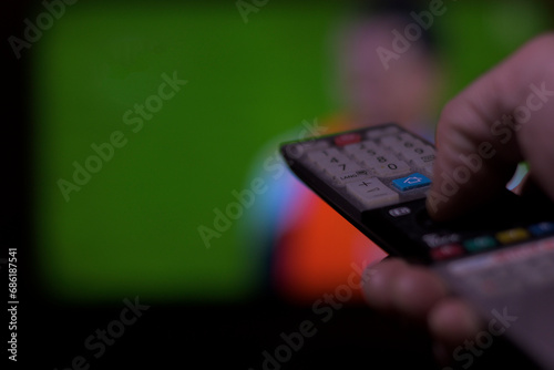 Wallpaper Mural Hand with television remote control changing television channels horizontally soccer Torontodigital.ca