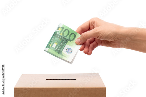 Fotografía charity, savings and fundraising concept - close up of hand putting euro cash mo
