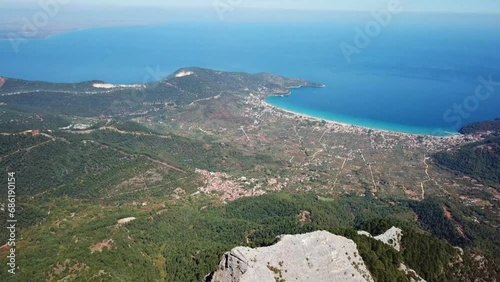 The sea and sea shore of the Thassos Island seen from high altitude on the Ypsarion or Ipsarion mountain in Thassos Island ,  Greece , south-eastern Europe , aerial drone footage. photo